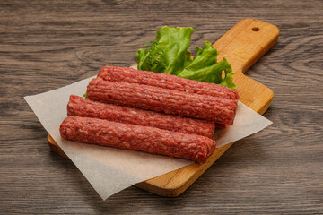 Raw beef sausages with spices