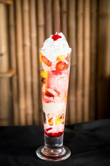 knickerbocker glory Ice cream sundae with fruit and whipped cream