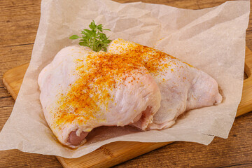 Raw chicken thigh with spices