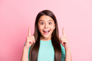 Close-up portrait of her she nice attractive pretty glad cheerful cheery long-haired girl pointing forefingers up copy space advert ad novelty isolated over pink pastel color background