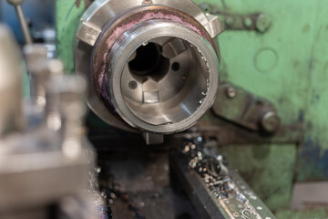 Detail on a lathe, metal cutting at a machine-building enterprise.