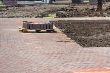 Repair work on laying paving slabs in the Ukrainian city at the autumn