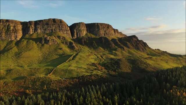 The majestic Binevenagh mountain located near Limavady on the north coast of N. Ireland during golden hour via drone