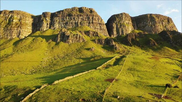 The majestic Binevenagh mountain located near Limavady on the north coast of N. Ireland during golden hour via drone