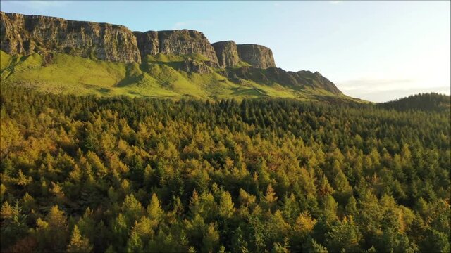 The majestic Binevenagh mountain located near Limavady on the north coast of N. Ireland during golden hour via drone
