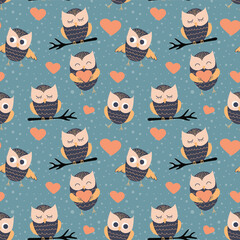 Seamless pattern with cute cartoon owls. Baby textile design. Vector illustration.