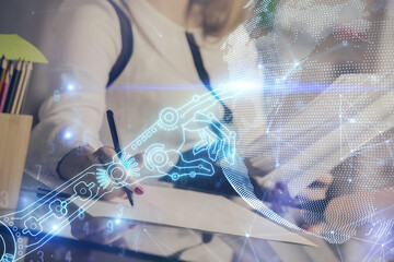 Technology theme hologram over woman's hands taking notes background. Concept of Tech. Double...