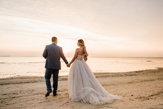 Bride And Groom On The Beach