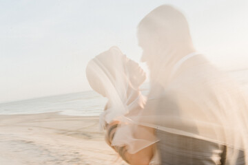 Fototapeta na wymiar bride and groom on beach