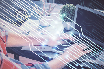 Double exposure of technology hologram with man working on computer background. Concept of big data.