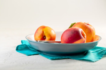 Three ripe nectarines. Concept of healthy eating.