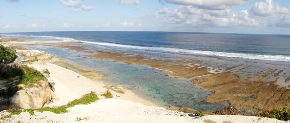 Obraz premium Melasti Beach on Bali Island in Indonesia with beautiful turquoise colored ocean water.