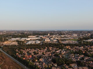 aerial view of housing and light industrial, retail development on the edge of heathland in Poole UK