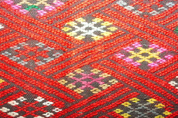 More than 100 years old colorful thai handcraft peruvian style rug surface old vintage torn conservation Made from natural materials Chemical free close up.