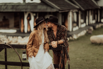 Loving couple on a  ranch in the western mountains in the autumn season. Elopement concept