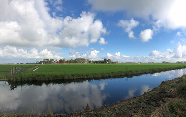 Canal with cloud reflection in Friesland