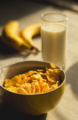 morning breakfast of cornflakes with milk and bananas
