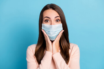 Portrait of crazy girl look in camera touch hands cheekbones wear mask isolated over blue pastel color background