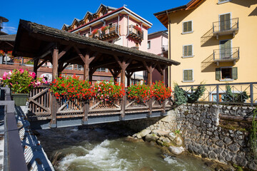 The typical wood bridge with flowers simbol of the town of Ponte di Legno, Brescia province, Italy.