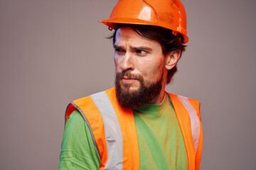 Man in working uniform orange paint safety work cropped view