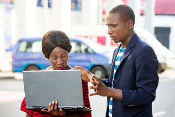 portrait of handsome man and beautiful businesswoman outdoors