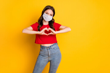 Photo of positive girl make fingers heart show passionate love sign wear mask isolated over bright...