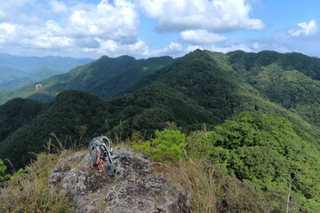 Fototapeta na wymiar Backpack, great outdoors and the mountains / 肩が痛いのでザックを降ろす。(群馬県・笠丸山の山頂にて)