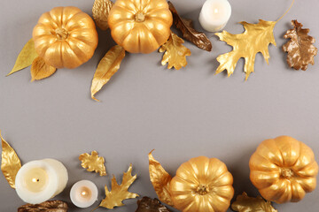 Fototapeta na wymiar Beautiful stylish autumn background with golden leaves and pumpkins top view with place for text