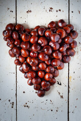 chestnuts on a wooden background