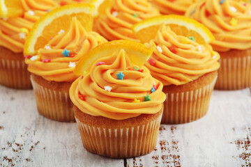 Cupcakes with orange icing on top