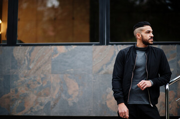 Portrait of stylish arab beard man wear grey turtleneck and black jaket. Arabian model guy.