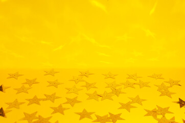Fototapeta na wymiar Template for greeting card.Shiny stars on the bright yellow background