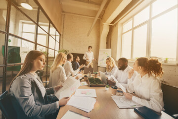 Group of people smart business sharks man woman sit table discuss company development plan cost staff dismissal recession in workplace workstation