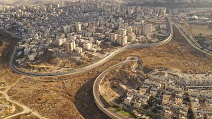 Israel and Palestine divided by Security wall Aerial view
Aerial view of Left side Anata Palestinian town and Israeli neighbourhood Pisgat zeev  
