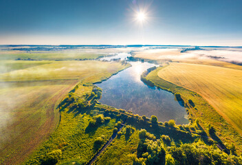 Perfect summer scene of Ukrainian countryside, Ternopil region. View from flying drone of Angelivka lake. Bright morning landscape on Ukraine, Europe. Traveling concept background.