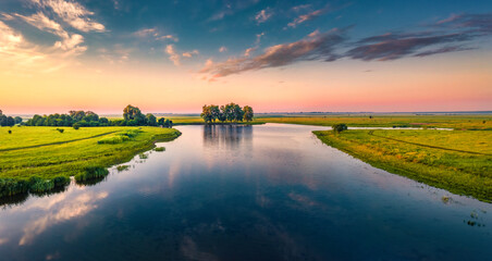 Fototapeta na wymiar Fabulous summer sunrise on Stara Brykulia lake, Ternopil region. Perfect rural scene from flying drone of Ukrainian countryside. Traveling concept background.