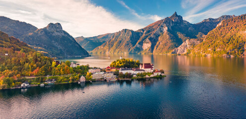 View from flying drone of Maria Kronung church. Colorful autumn scene of Traunsee lake. Nice landscape of Austrian Alps with Traunstein peak on background, Austria, Europe.