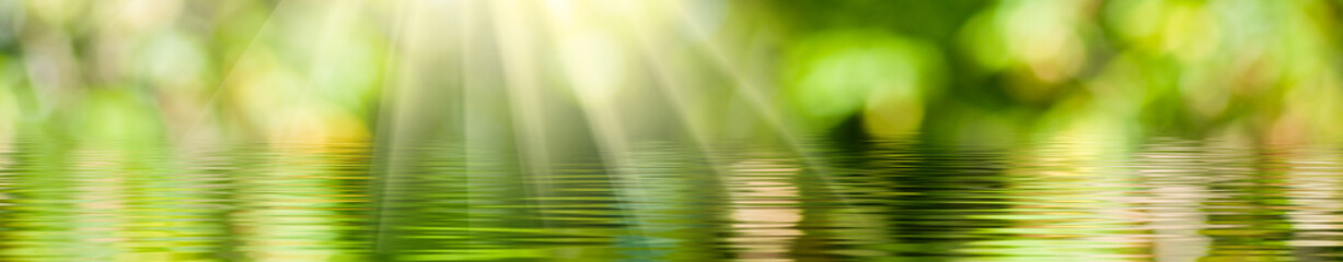 image of a water surface illuminated by rays of light