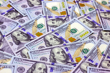 American hundred dollar bills as a money background. Business and finance concept.