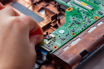 Fixing different electronic components inside the pc with the hand. Computer hardware, service, upgrade and technology repairing concept.