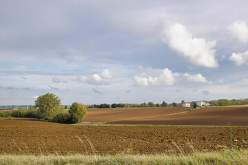 Fototapeta na wymiar plowed land in a country autumnal landscape