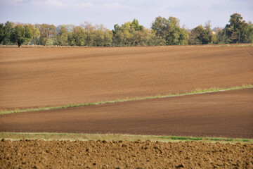 Fototapeta na wymiar fields on the hills with plowed land