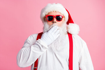 Fototapeta na wymiar Astonished santa claus close cover white gloves mouth say gift present wish dream surprise delivery x-mas christmas event wear style sunglass headwear isolated pastel color background