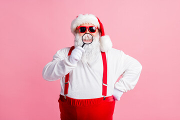 X-mas christmas medical clinic sales. White grey beard hair santa claus show healthy teeth loupe magnifier enjoy doctor treatment wear cap suspenders overalls isolated pastel color background