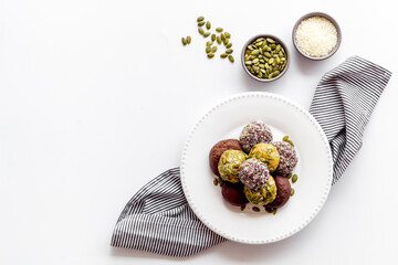 Top view of raw vegan energy balls with nuts and cacao