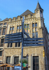 Aachen / Germany - December 28, 2019: Signs posts indicating the direction of tourist places of the...