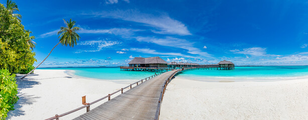 Amazing beach panorama at Maldives. Luxury resort villas seascape with paradise island coast....