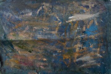 Abstract oil paint on dark blue background. Brush strokes in light colors.