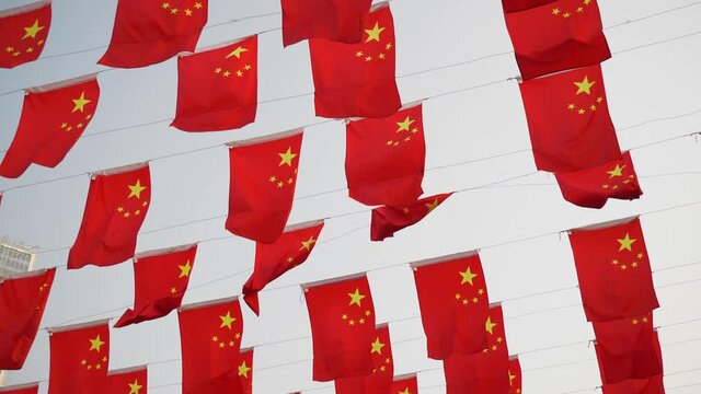 sunny day changsha city national flags wave on the rope slow motion up view 4k china