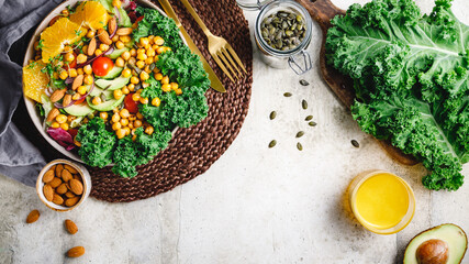 Healthy vegetarian salad with avocado, chickpea, fresh kale, romano leaf, cherry tomatoes, almond....